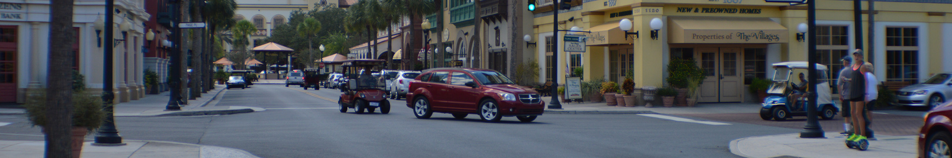 photo of The Villages with golf carts and cars