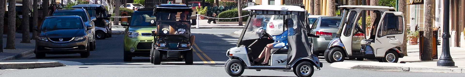 photo of The Villages with golf carts and cars