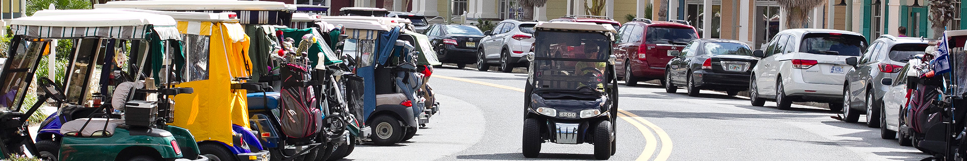 photo of The Villages with golf carts and cars